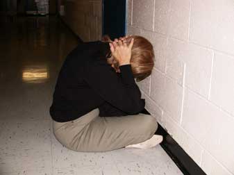 Demonstrating 'Duck and Cover' a Cold War procedure believed to protect one self in the event of a neuclear attack.