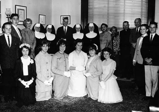 1960 graduates and Village staff of St. Joseph's Village pose with Congressman, Representative Frank C. Osmers.